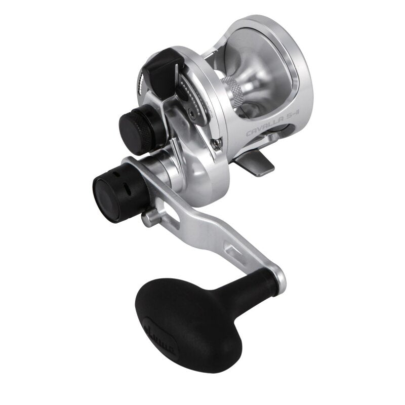OKUMA Cavalla Two Speed 5II RH fishing reel with a sleek silver finish, ergonomic handle, and durable construction for saltwater fishing.